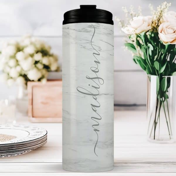 White Marble Tumbler With The Name Madison In A Script Font.