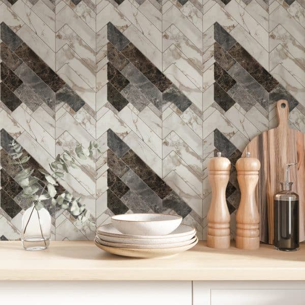 Chevron Patterned Marble Tile Backsplash With Stacked Dishes And Kitchen Utensils On A Wood Counter.