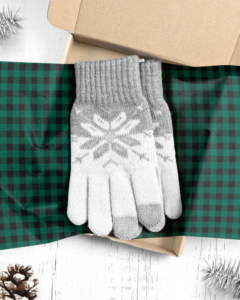 Pair of grey and white snowflake patterned gloves in a gift box.