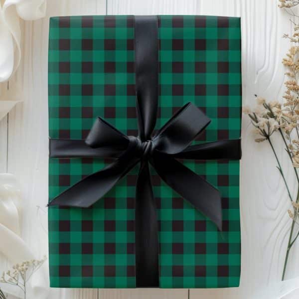 Green And Black Plaid Gift Box With A Black Ribbon.