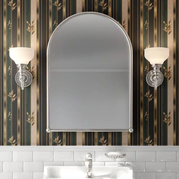 Arched Mirror Flanked By Wall Sconces Above A Bathroom Sink.