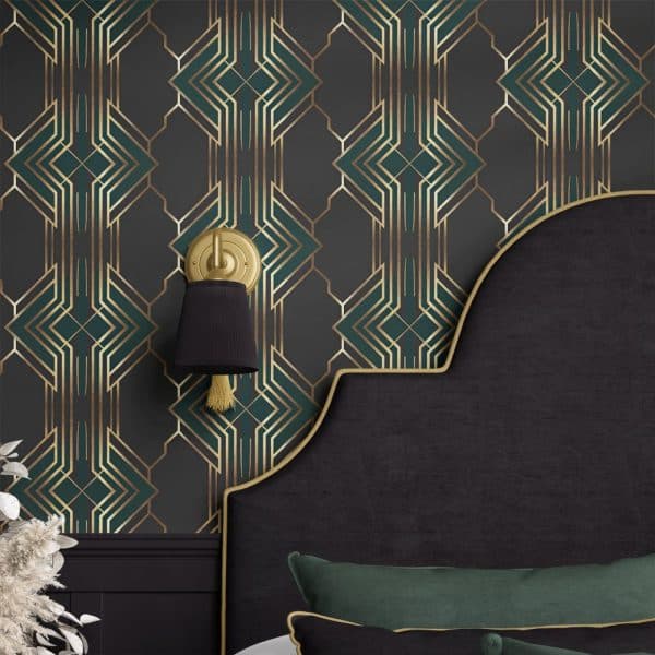 Dark Headboard With Gold Trim Against A Wall With Art Deco Wallpaper In Teal And Gold.