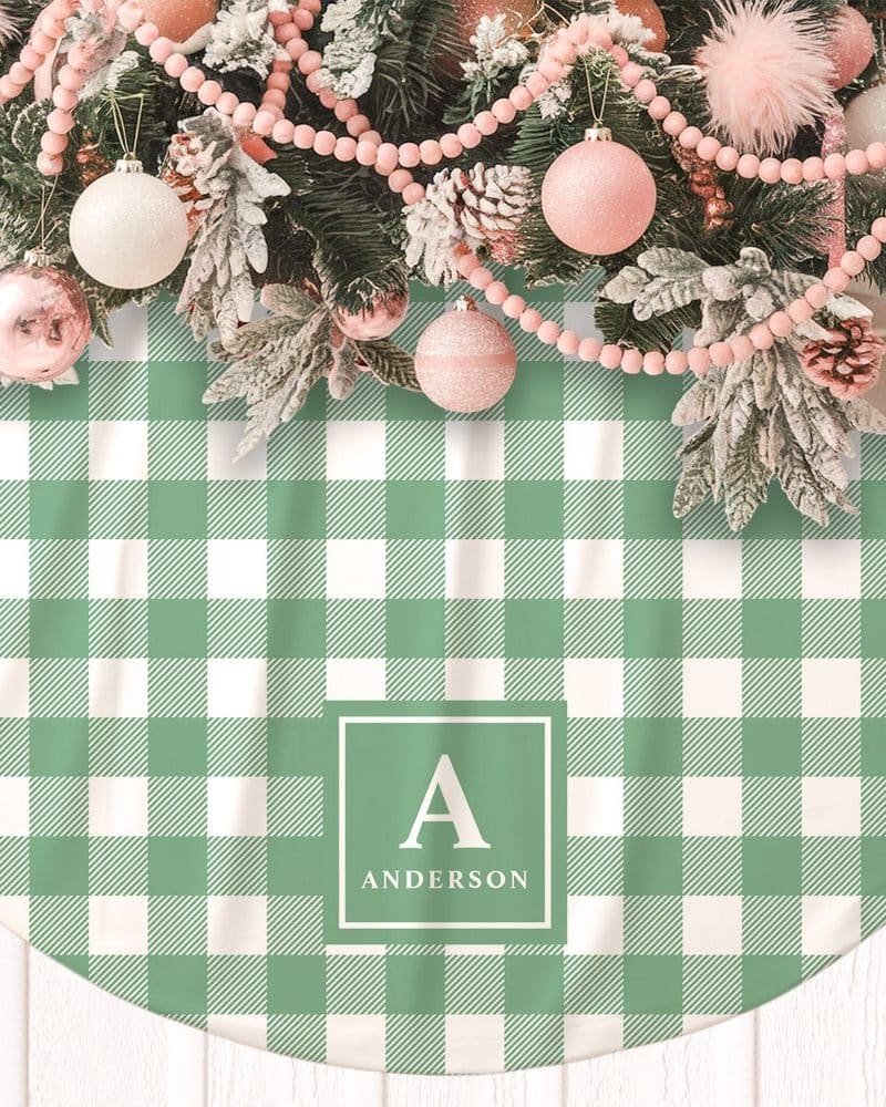 Green and white gingham Christmas tree skirt with the initial A and the name Anderson.