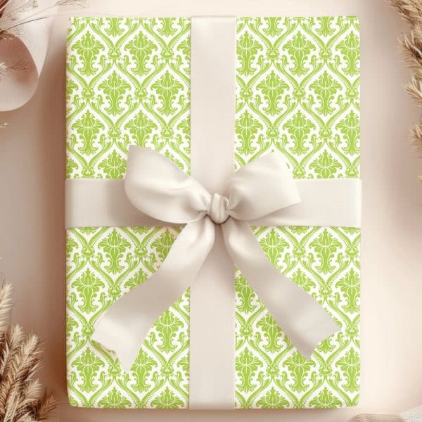 A Lime Green And White Damask Patterned Gift Box With A Large Off-White Bow.