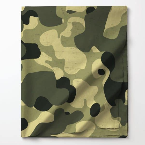 Folded Fabric With A Camouflage Pattern In Shades Of Green And Tan.