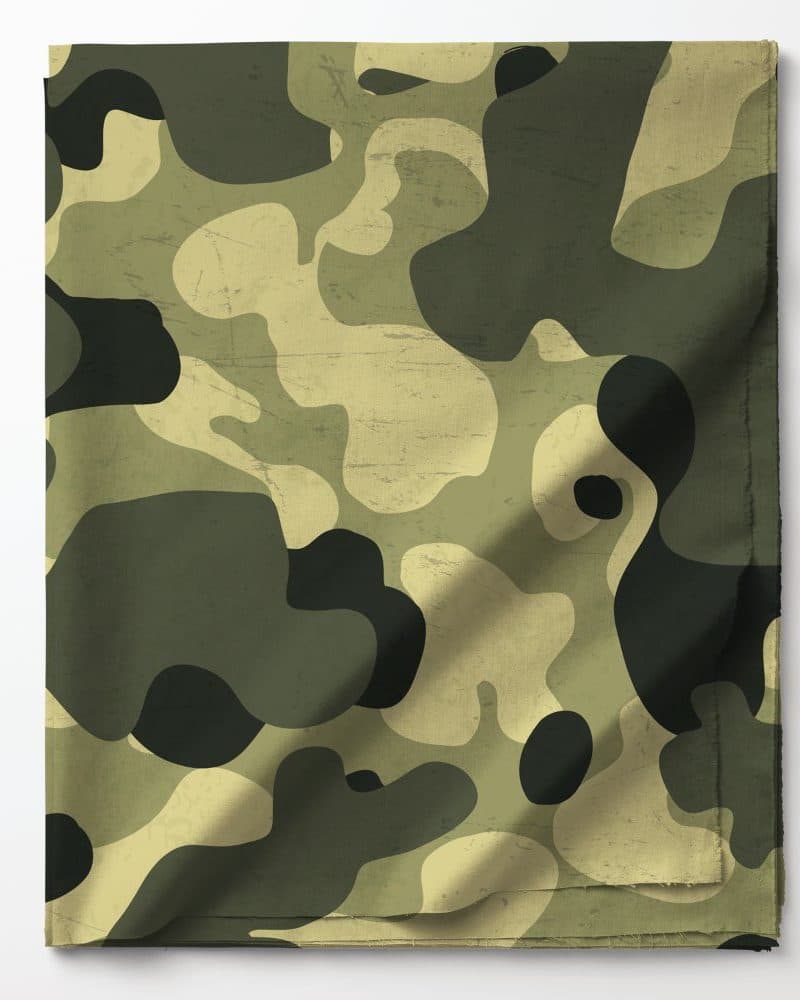 Folded fabric with a camouflage pattern in shades of green and tan.