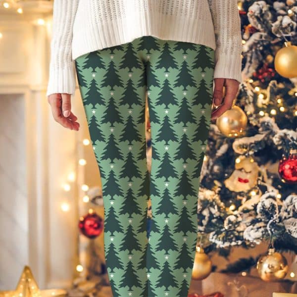 Green Leggings With A Repeating Pattern Of Dark Green Christmas Trees And Small White Stars.