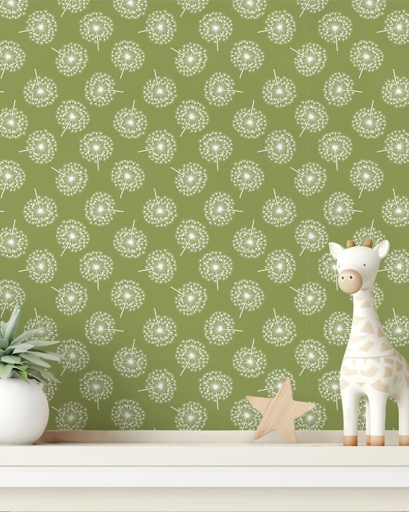 Olive green wall with a repeating pattern of white dandelions, featuring a small giraffe toy and a potted plant on a shelf.