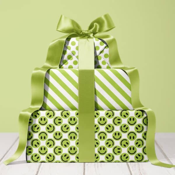 A Stack Of Three Lime Green Gifts, Tied With A Large Lime Green Ribbon. The Wrapping Paper Features Different Patterns: Polka Dots, Stripes, And Smiley Faces.