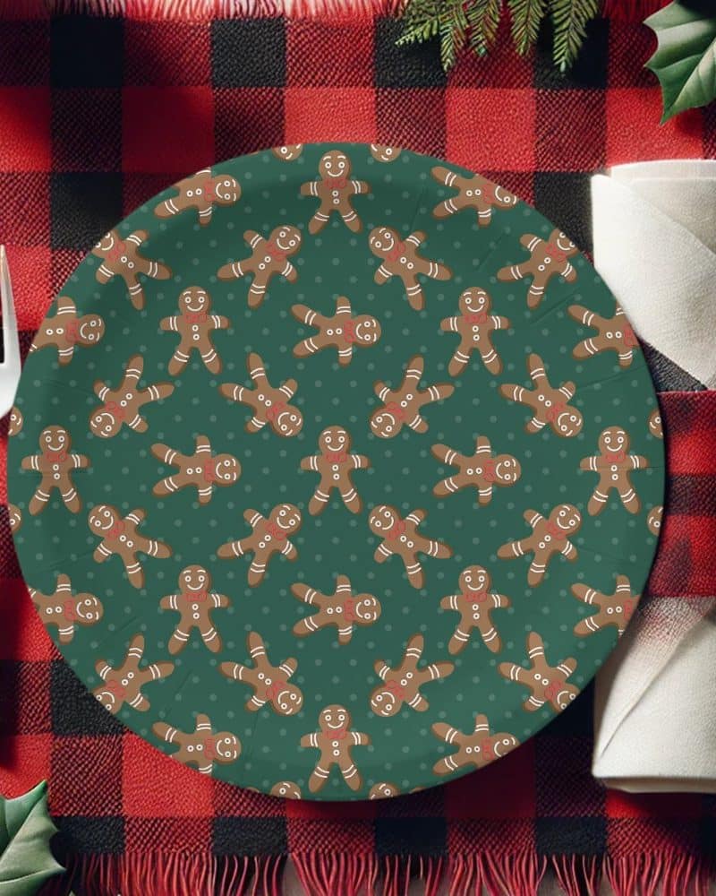 Green paper plate with a repeating pattern of gingerbread men.
