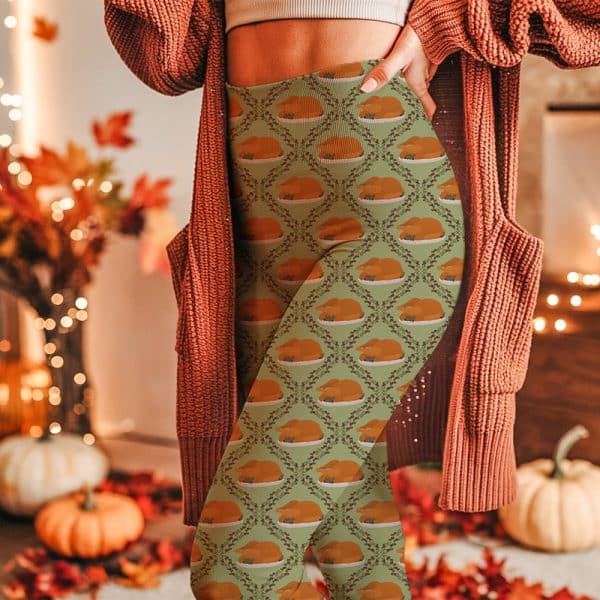 A Person Wearing Light Green Leggings Patterned With Roasted Turkeys And Greenery.