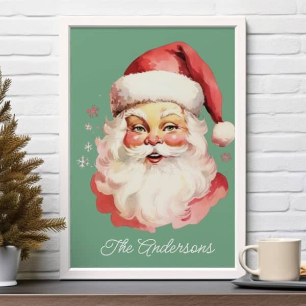 Framed Illustration Of Santa Claus'S Face, With The Name Andersons Below.