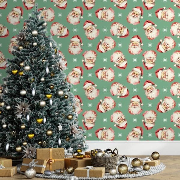 Decorated Christmas Tree Next To A Wall With A Repeating Pattern Of Santa Claus Faces.