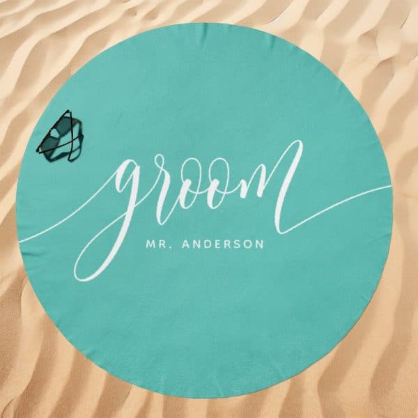 Teal Round Beach Towel With The Word Groom And Mr. Anderson In White Script.