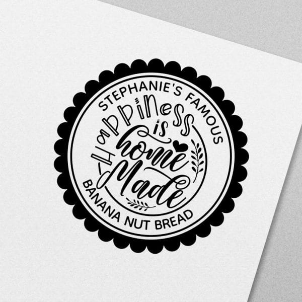 Black And White Circular Logo With Scalloped Edges. Text Reads, Stephanie'S Famous Happiness Is Homemade Banana Nut Bread.
