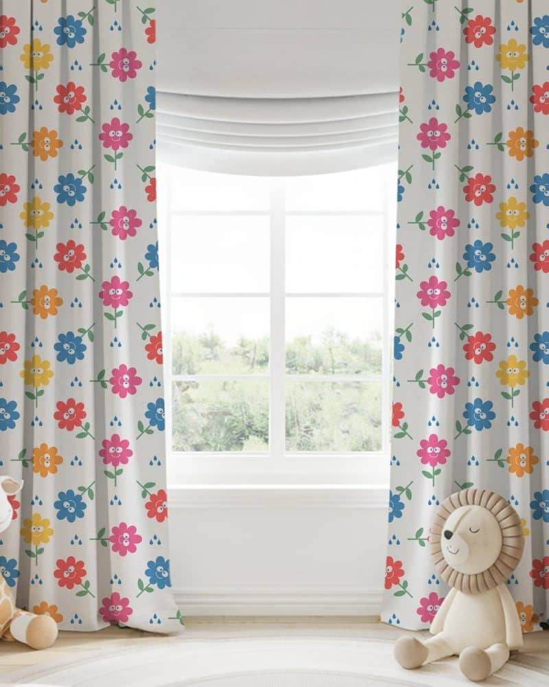 Pair of children's curtains featuring a light gray background with a repeating pattern of colorful smiling flowers and raindrops.