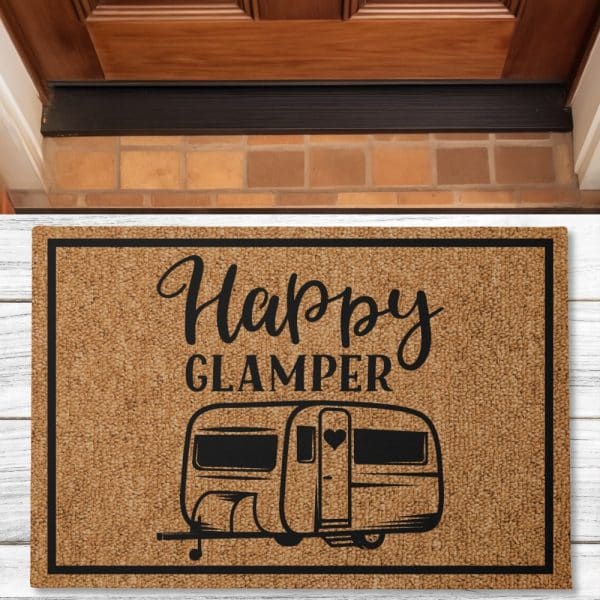 Tan Doormat With Black Text And Image Of A Camper. The Text Reads Happy Glamper.