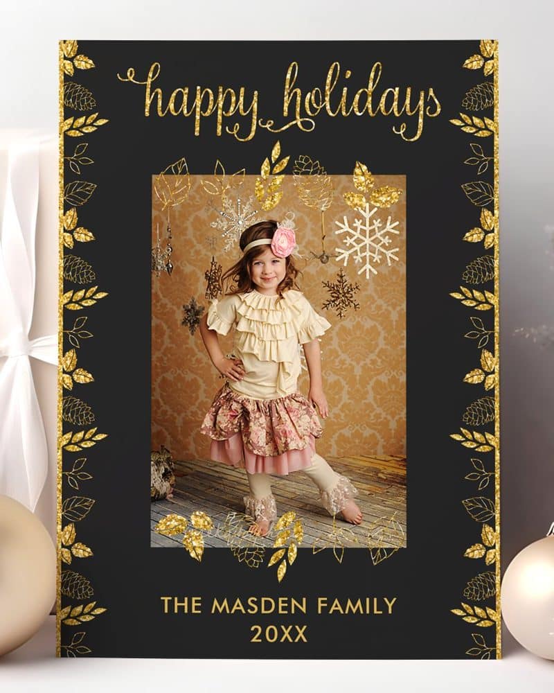 Black holiday card with gold glitter border and a photo of a young girl. The card says Happy Holidays and The Madsen Family.
