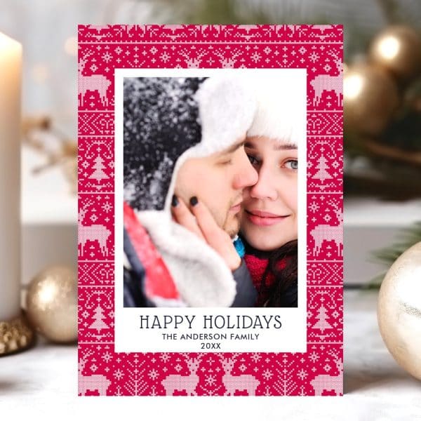 Holiday Card Featuring A Close-Up Photo Of A Couple Embracing, Framed By A Festive Red And White Knit Pattern.