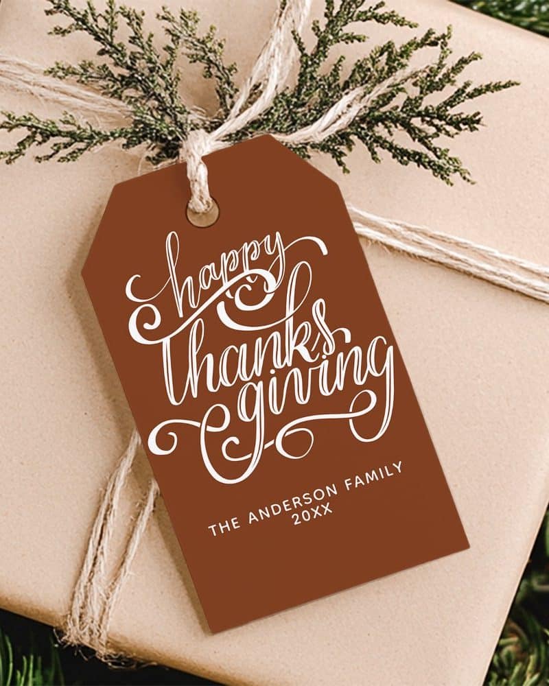 Brown Thanksgiving gift tag with white cursive lettering that says Happy Thanksgiving and The Anderson Family 20XX.