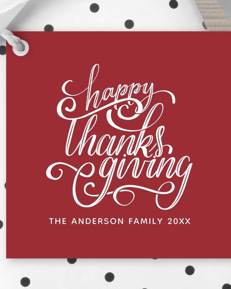 Red Thanksgiving gift tag with white script lettering that says Happy Thanksgiving. The Anderson Family 20XX is also printed on the tag.