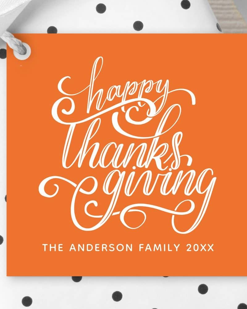 Orange Thanksgiving gift tag with white cursive lettering that says Happy Thanksgiving and the Anderson Family.