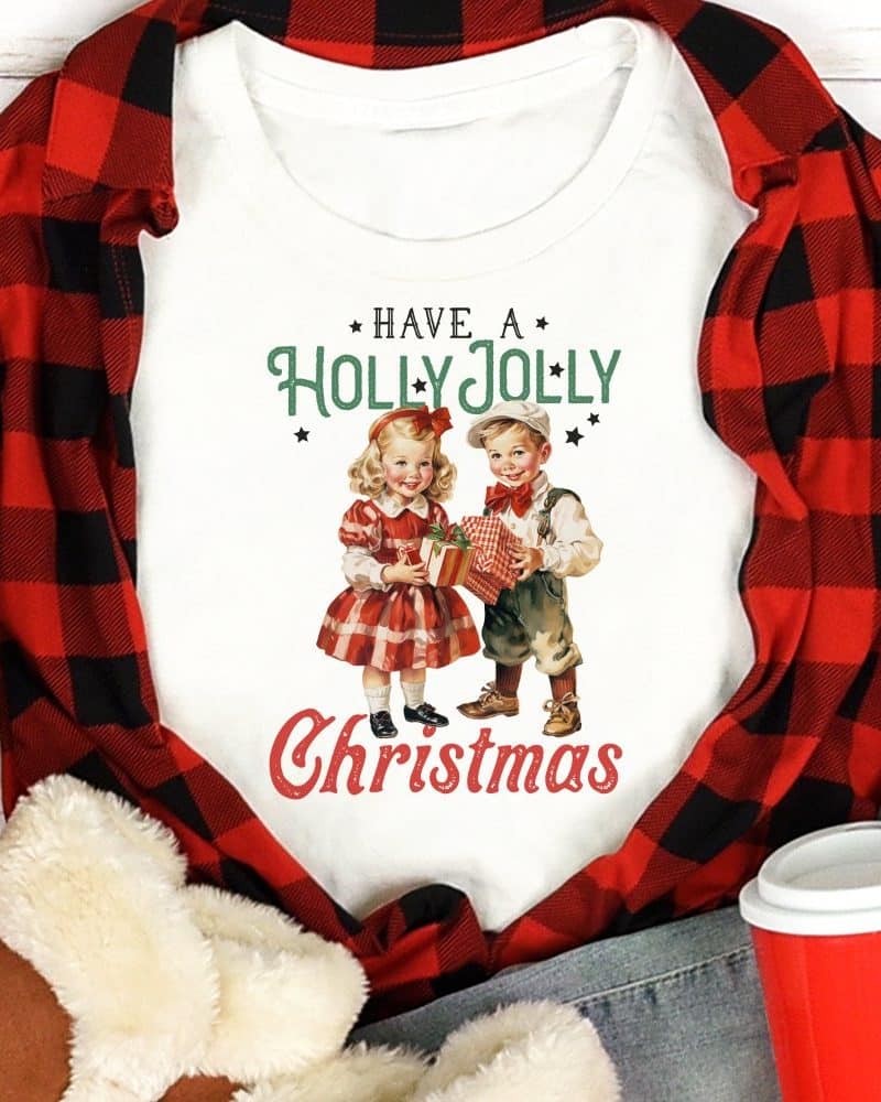 White Christmas shirt featuring a vintage illustration of two children holding gifts, with the text Have a Holly Jolly Christmas.
