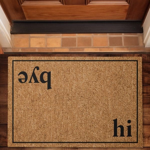 Tan Coir Doormat With Black Text That Says &Quot;Hi&Quot; And A Backwards &Quot;Pqe&Quot;.