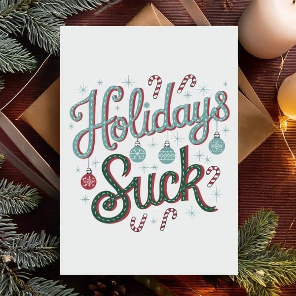 Humorous Holiday Card With The Text Holidays Suck In Decorative Lettering, Surrounded By Ornaments And Candy Canes.