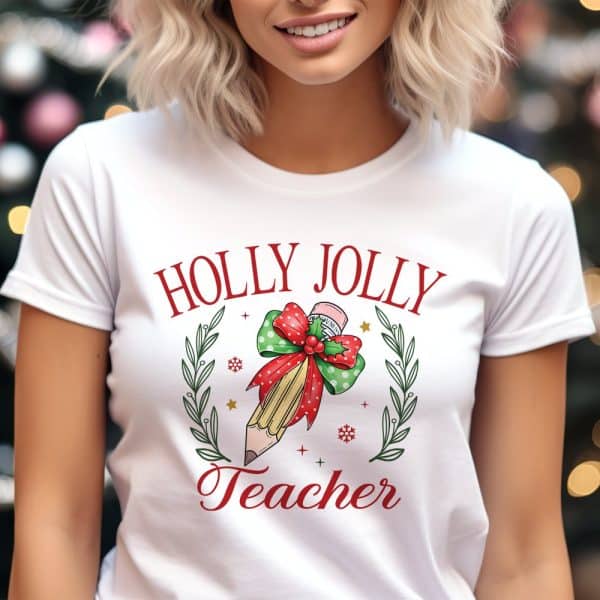 White T-Shirt With A Christmas Design: Holly Jolly Teacher. A Pencil Is Adorned With A Festive Bow And Greenery.