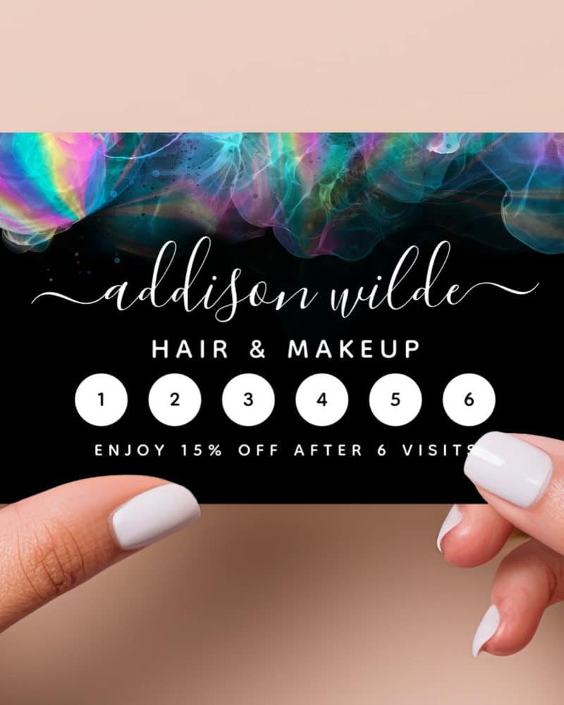 Black loyalty card with iridescent design, featuring Addison Wilde Hair & Makeup, and six visit spaces to earn a 15% discount.