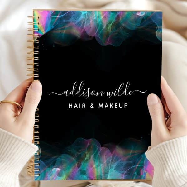 Spiral-Bound Notebook With A Black Cover Featuring Iridescent Teal And Purple Abstract Designs And The Name Addison Wilde Hair &Amp; Makeup.