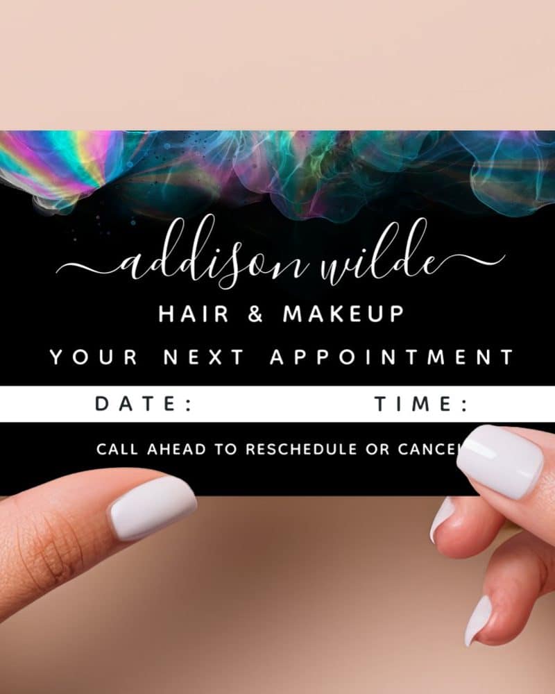 Appointment card for Addison Wilde Hair & Makeup, featuring iridescent design.