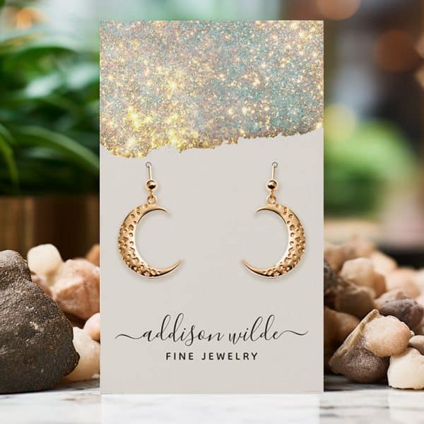 Gold Crescent Moon Earrings Displayed On A Card.