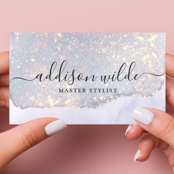 A Sparkly Light Blue And White Business Card For Addison Wilde, Master Stylist.