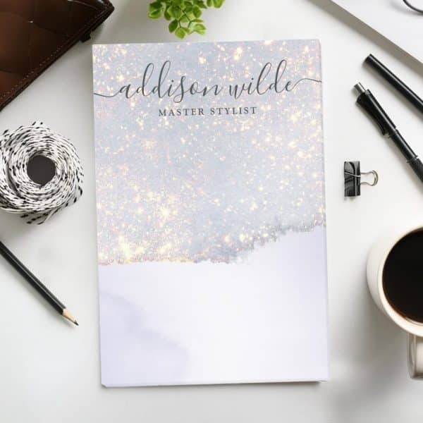 Addison Wilde Master Stylist Notebook With A Sparkly Light Gray And White Cover.