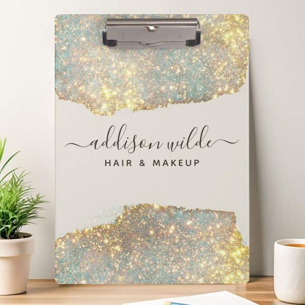 A Clipboard With A Sparkly Gold And Teal Design, The Name Addison Wilde Hair &Amp; Makeup.
