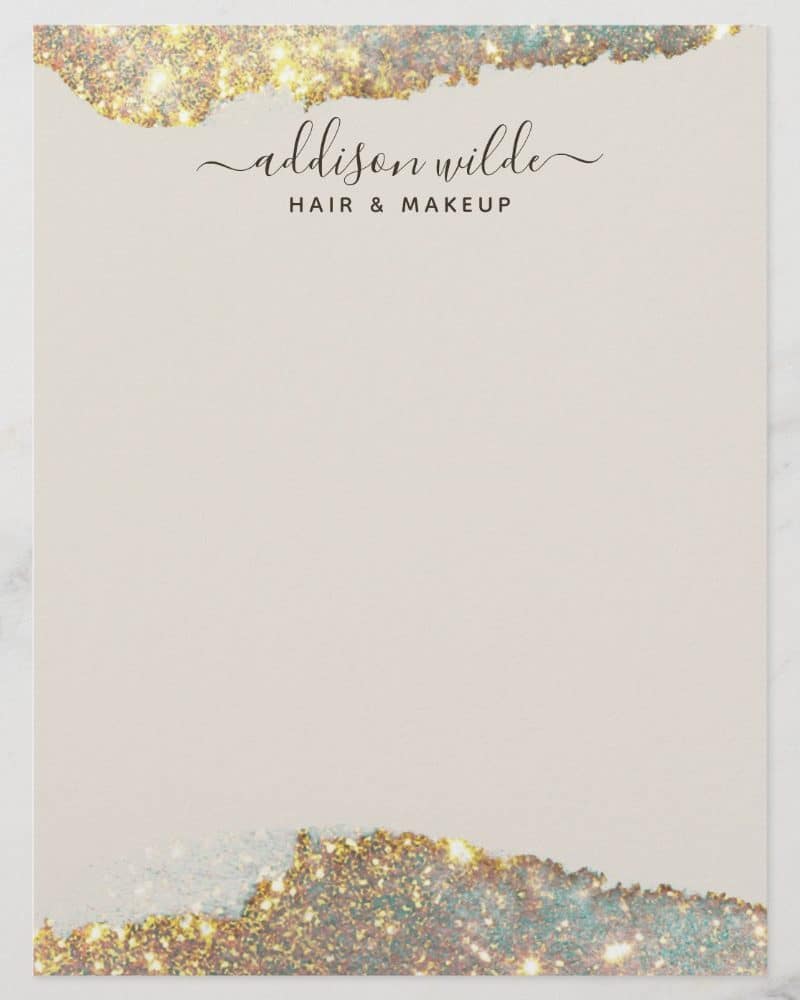 Beige stationery with gold glitter accents and the text Addison Wilde Hair & Makeup.