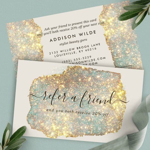 Two Refer-A-Friend Cards With Gold Glitter Accents. The Cards Advertise 20% Off For Both The Referrer And Friend.