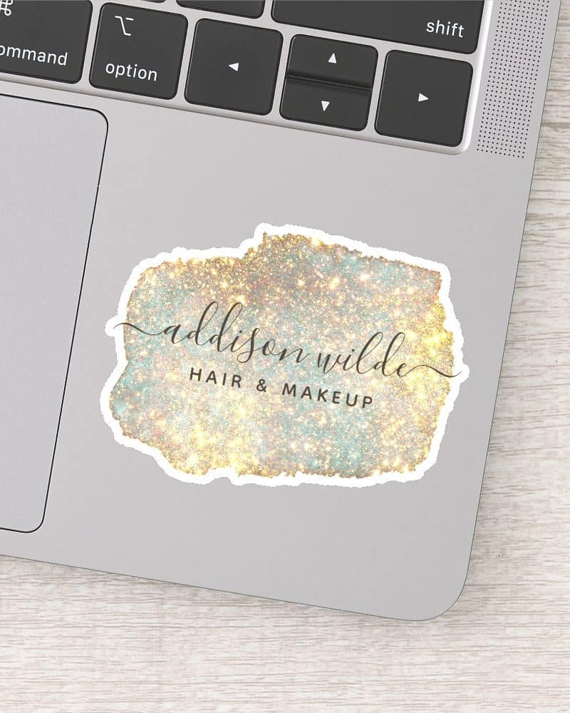 Addison Wilde Hair & Makeup logo sticker on a laptop.