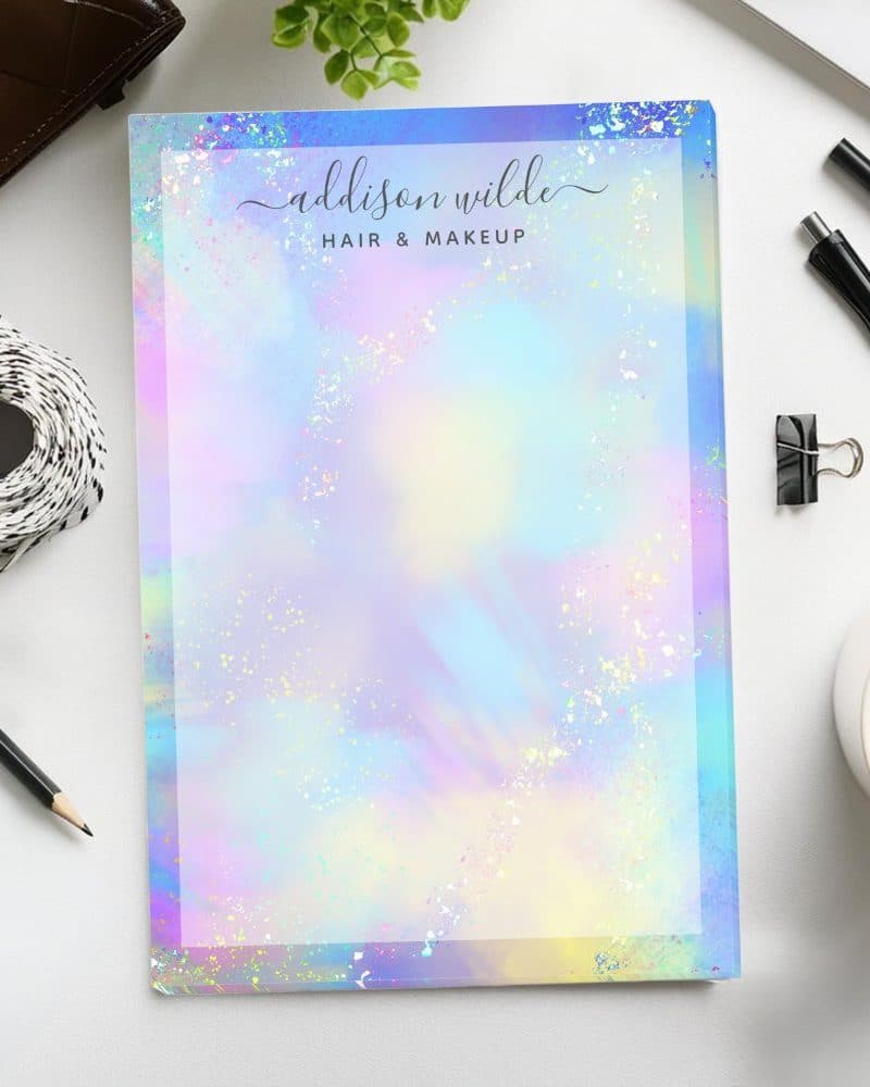 Pastel iridescent notepad with the name Addison Wilde Hair & Makeup at the top.