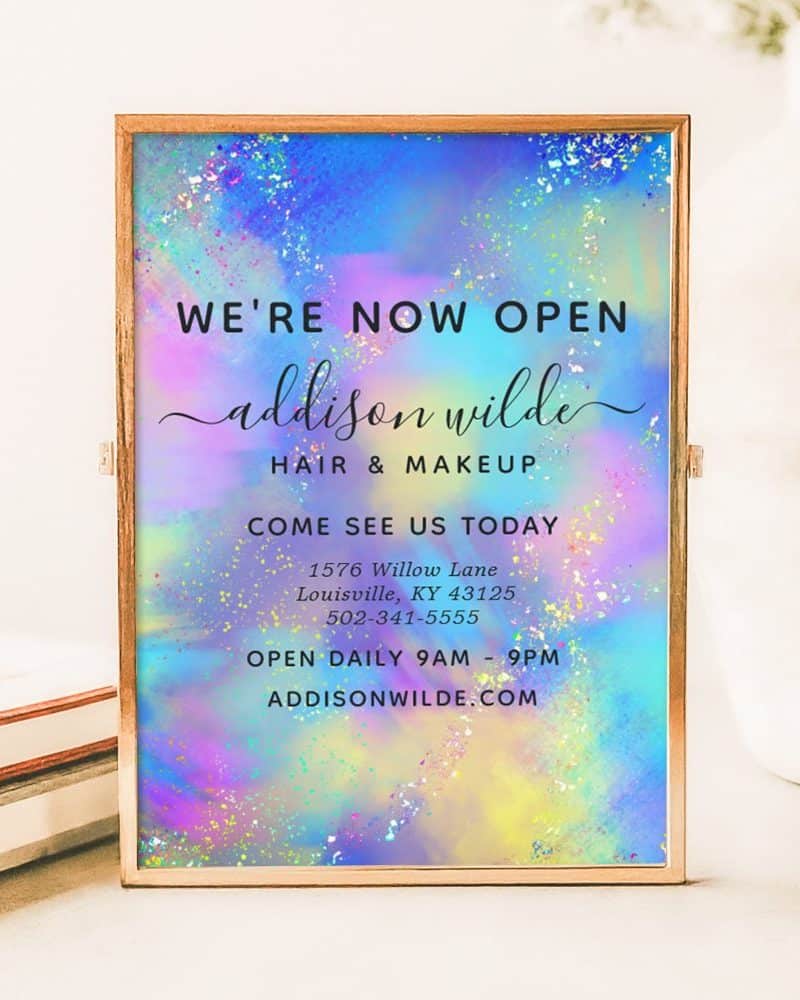 A pastel-colored announcement for Addison Wilde Hair & Makeup, stating they are now open, with their address, phone number, and website.