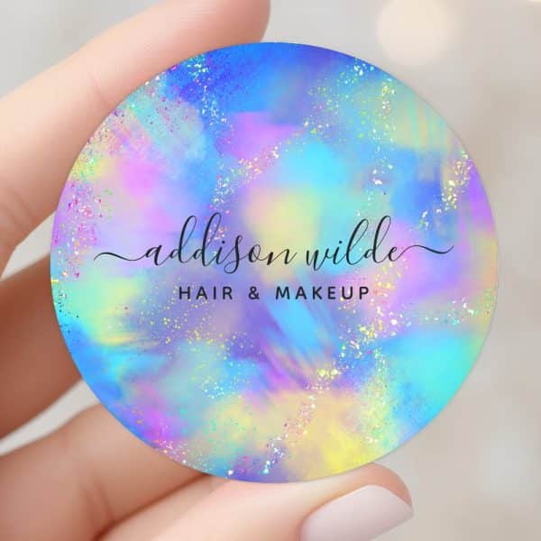 Round Hair And Makeup Business Card With Iridescent Pastel Design And Glitter. Addison Wilde Is Printed In Elegant Script.