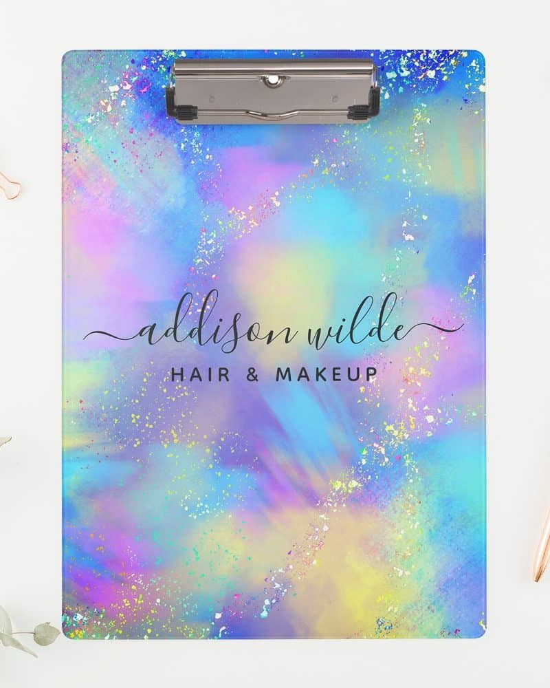Pastel rainbow clipboard with Addison Wilde Hair & Makeup logo.