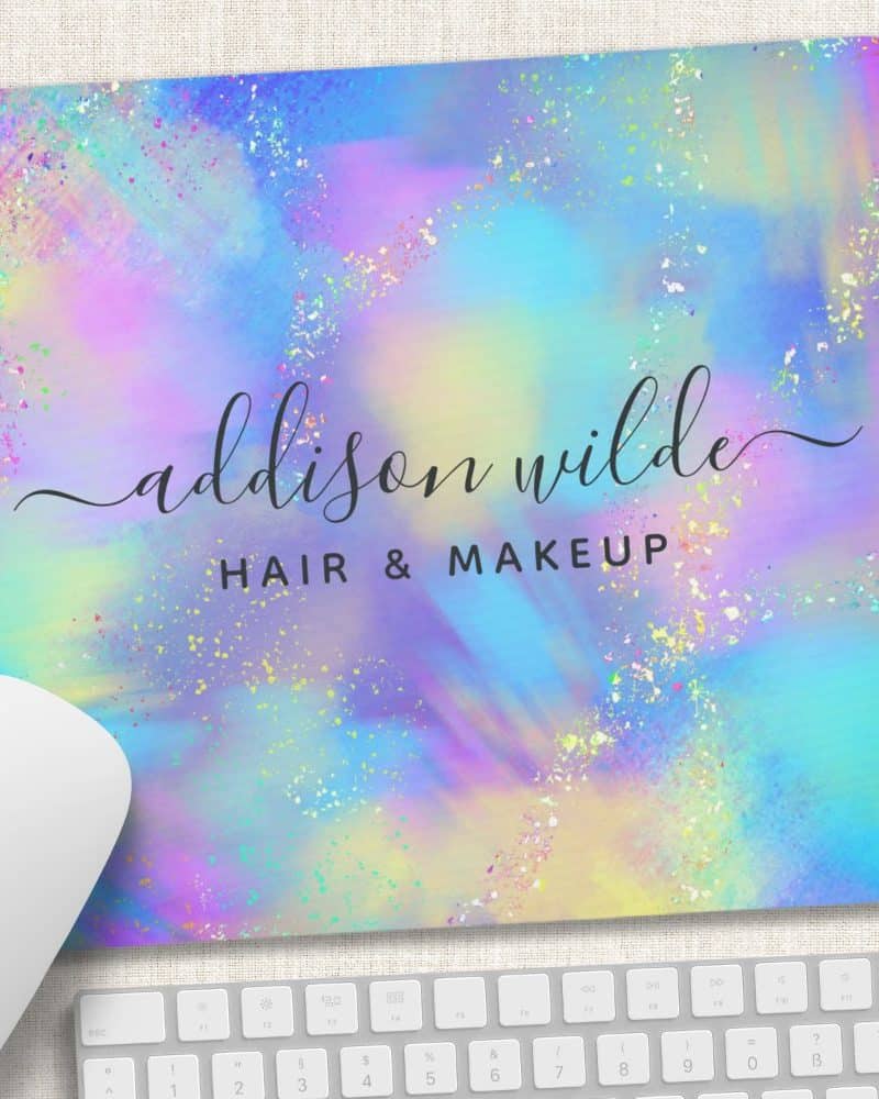 Pastel rainbow mousepad with glitter and the name Addison Wilde Hair & Makeup.