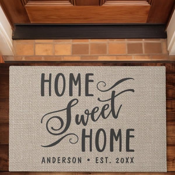 Beige Doormat With The Text Home Sweet Home In A Stylized Font, And The Family Name Anderson And Established Year Below.