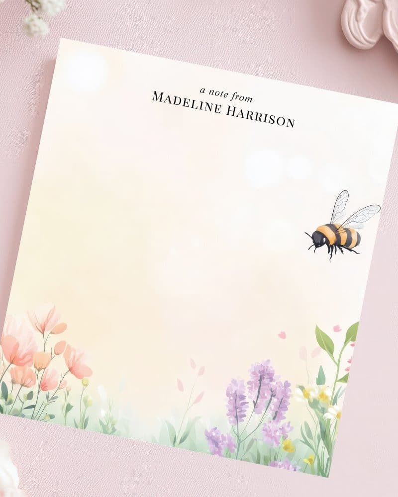 Personalized stationery featuring a bee and wildflowers.