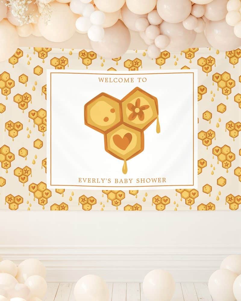 Baby shower banner featuring a honeycomb design with hearts and flowers, announcing Everly's baby shower.