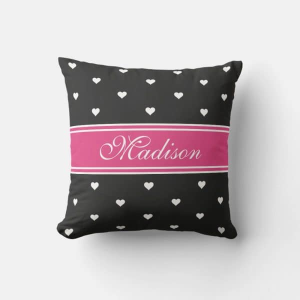 Black Pillow With White Hearts And A Pink Band Reading Madison.