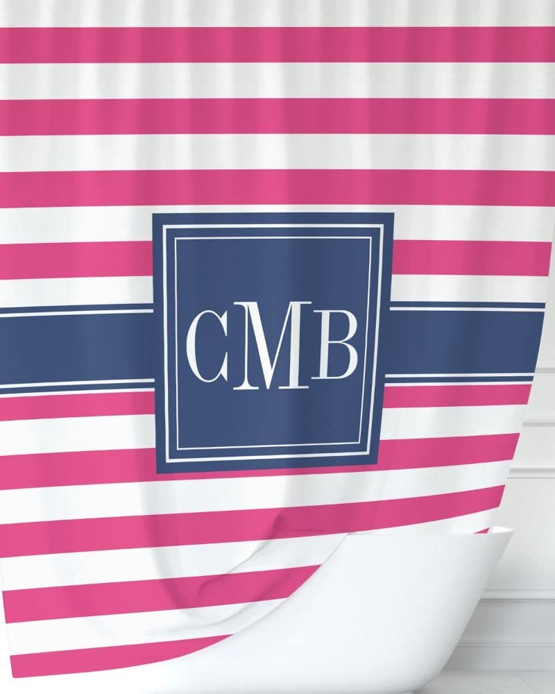 Pink and white striped shower curtain with navy blue monogram CMB.